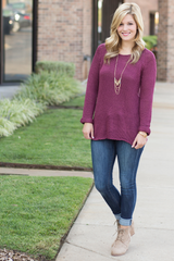burgundy sweater with rolled sleeves