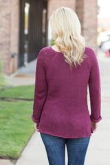 burgundy sweater with cuffed sleeves