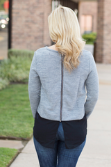 gray sweater with black bottom