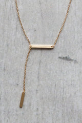 gold dangling bar necklace