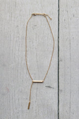 Gold hanging bar necklace