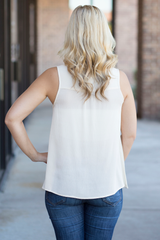 ivory top with coral embroidery