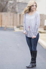 leopard print top with black boots and cute necklace