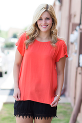 orange shift top