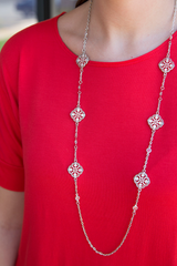 long silver ornate necklace